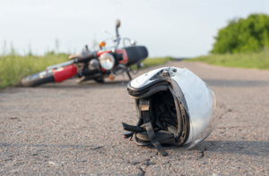 motorcycle crash on side of rural road in Norman, OK