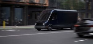 delivery truck driving on downtown street with passing black car