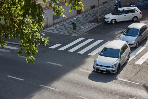 cars turning onto a street