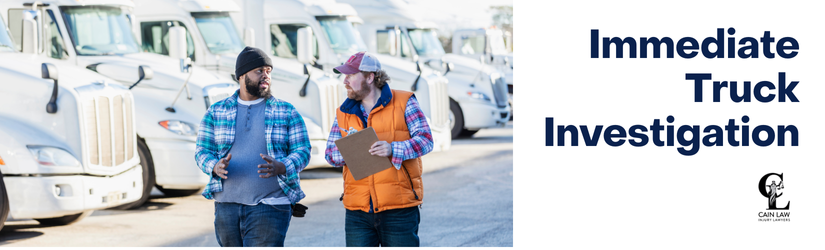branded with image of two individuals discussing a truck accident in front of trucks